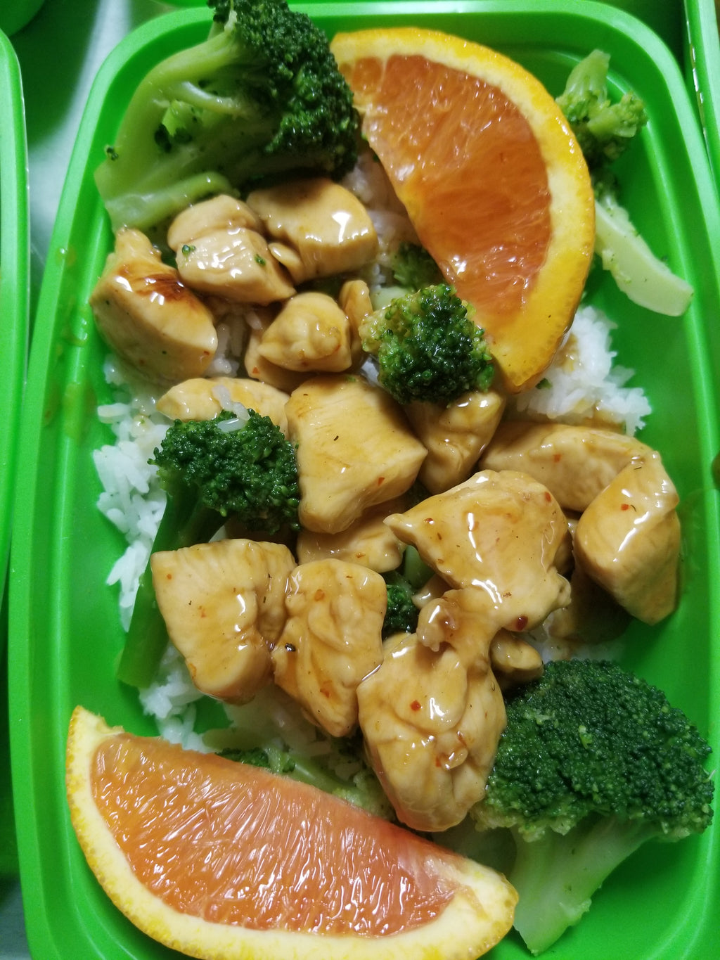 orange chicken with broccoli and orange slices  best meal delivery
