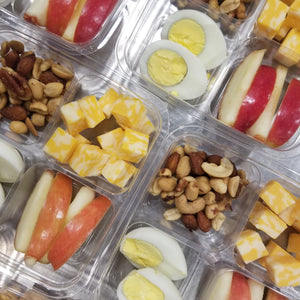 red sliced apples, hard boiled eggs, nuts and cheese cubes  best meal delivery